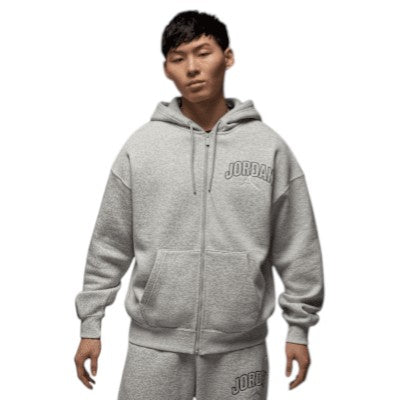 Person wearing a gray hoodie with 'Jordan' branding on a white background