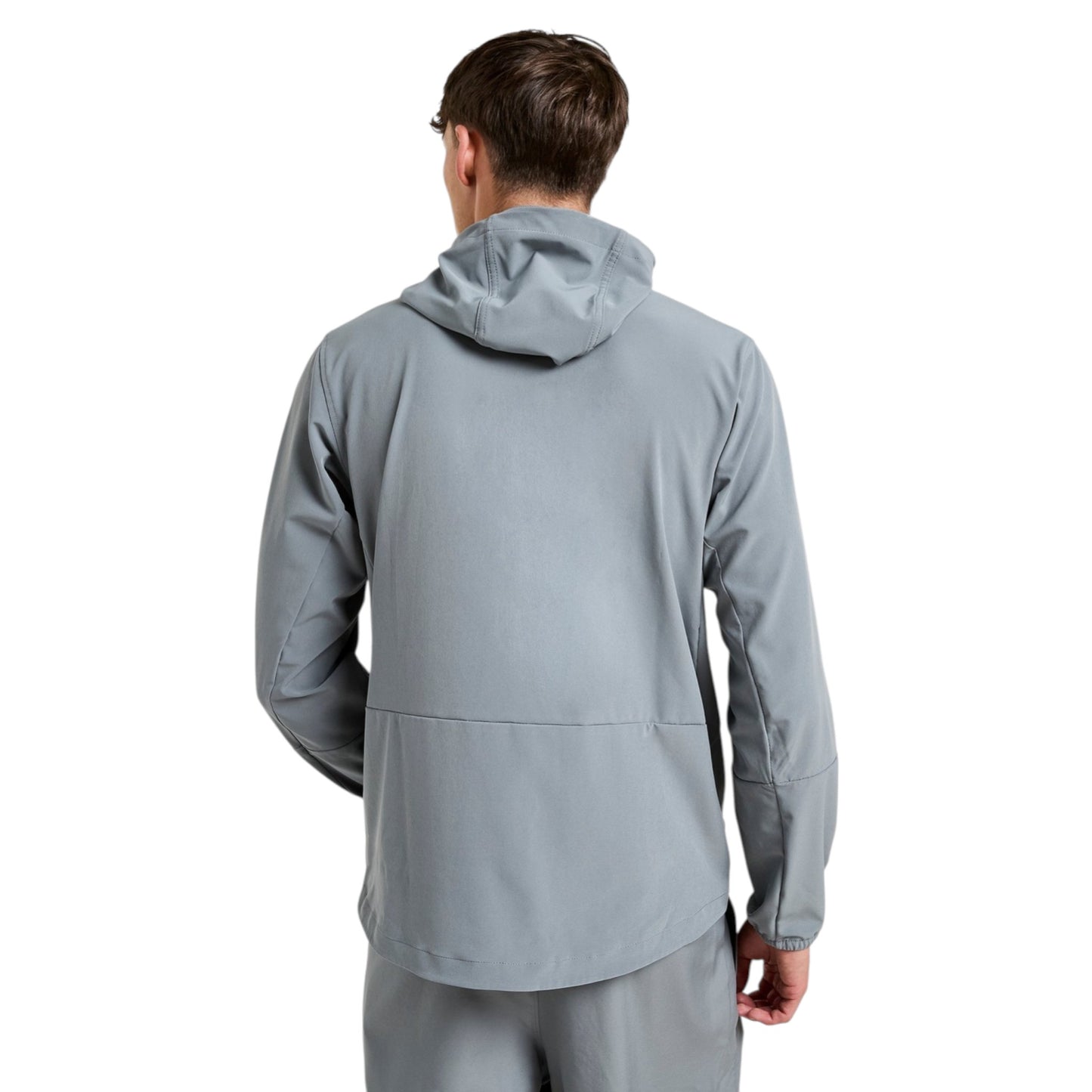 Person wearing a gray jacket on a white background