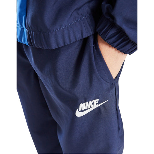Navy blue Nike tracksuit with white logo on a white background