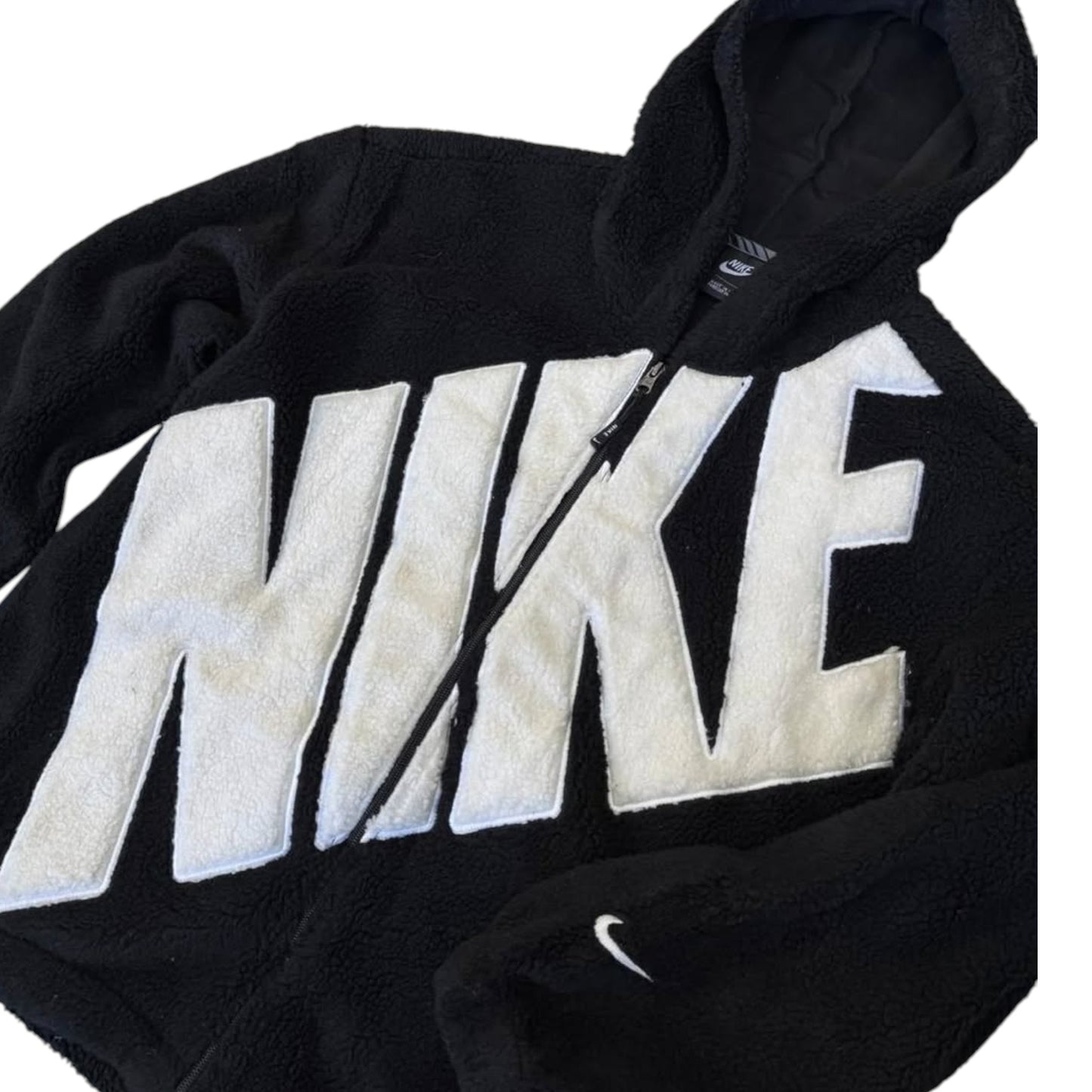 Black hoodie with large white 'Nike' logo on a white background