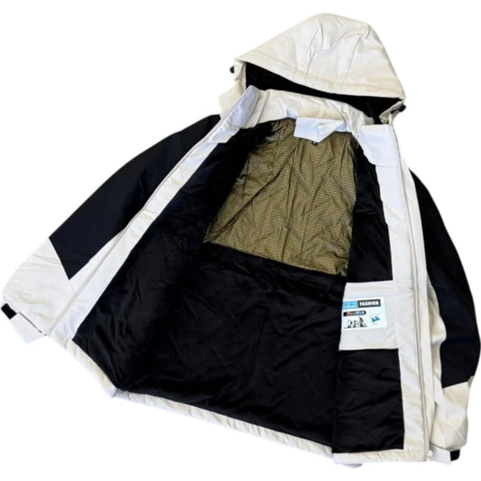 Black and white jacket with a hood open, showing green lining inside on a white background