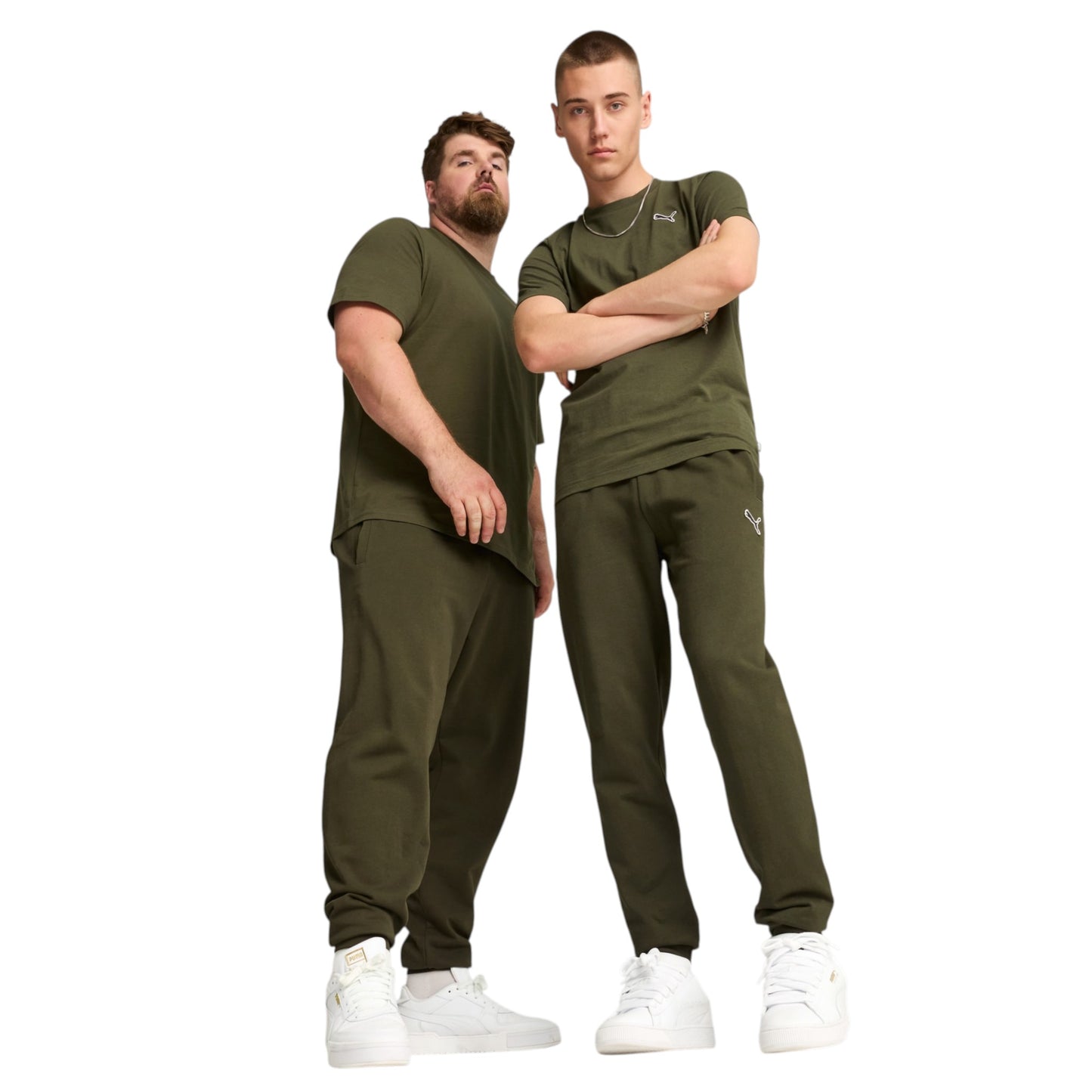 Two men wearing matching green outfits with white shoes on a white background