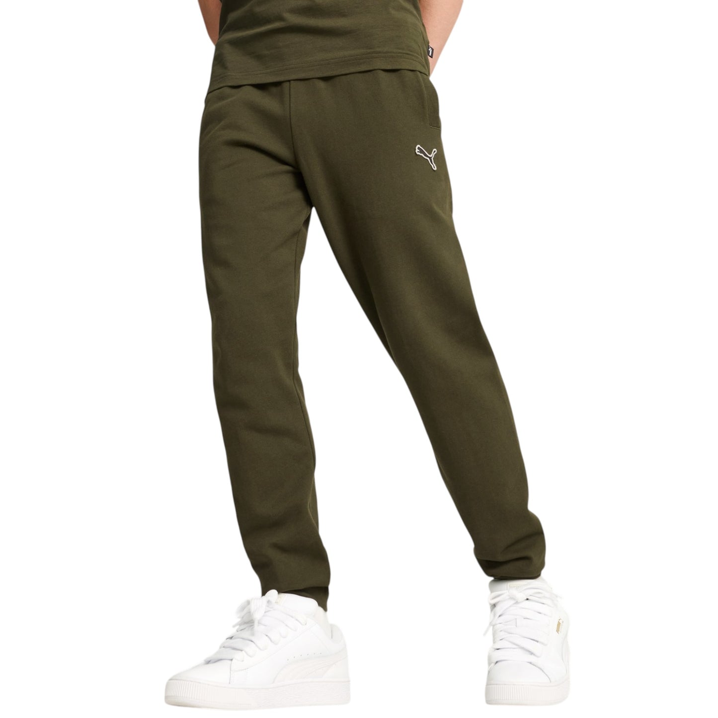 Green jogger pants with a small white logo worn by a person on a white background