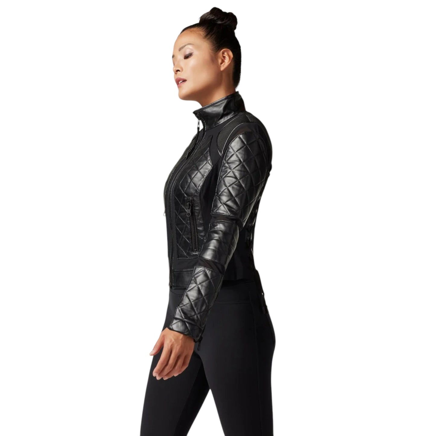 Person wearing a black quilted jacket on a white background