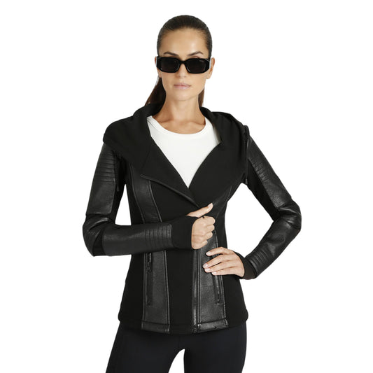 Woman wearing a black leather jacket and sunglasses on a white background