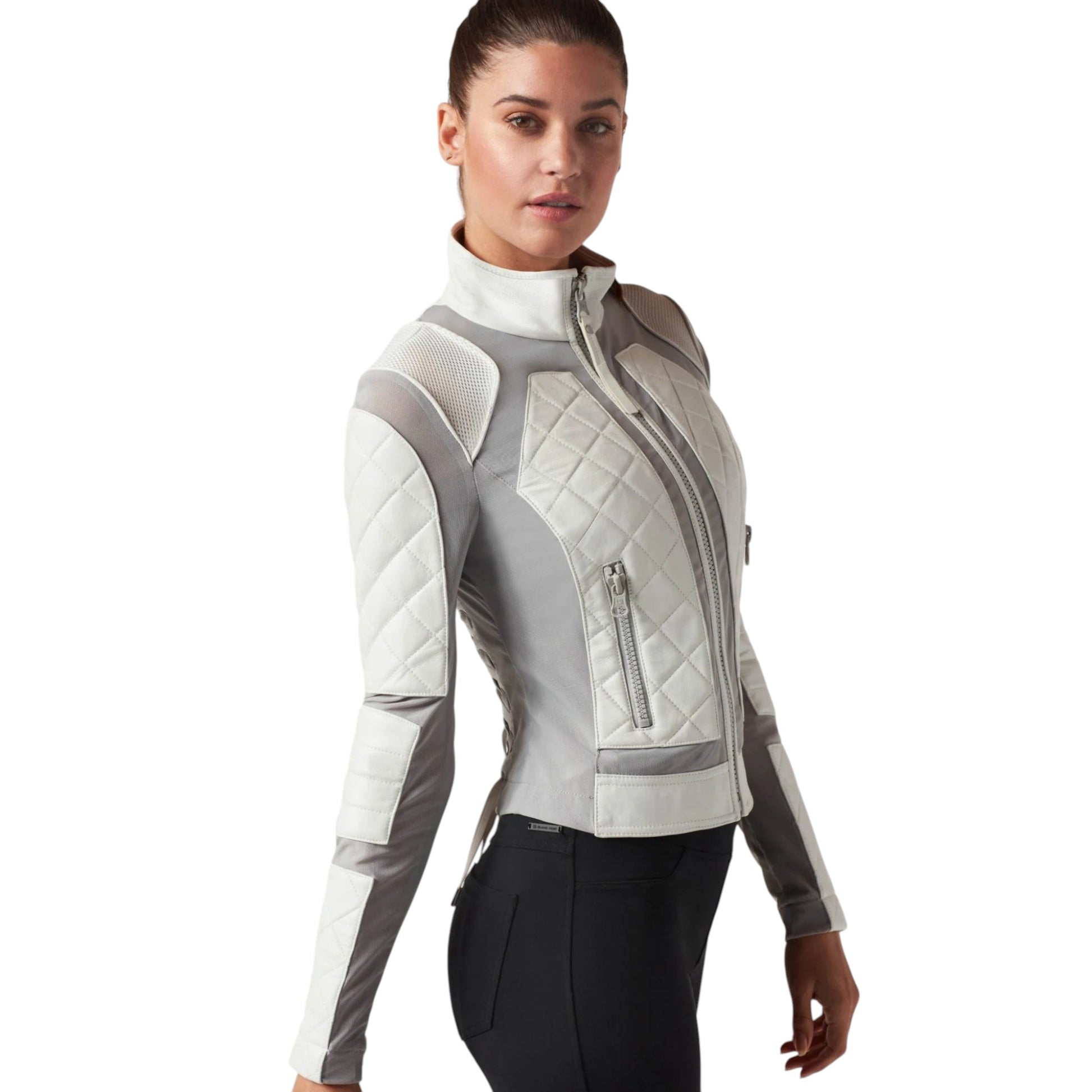 Woman wearing a gray and white quilted jacket on a white background