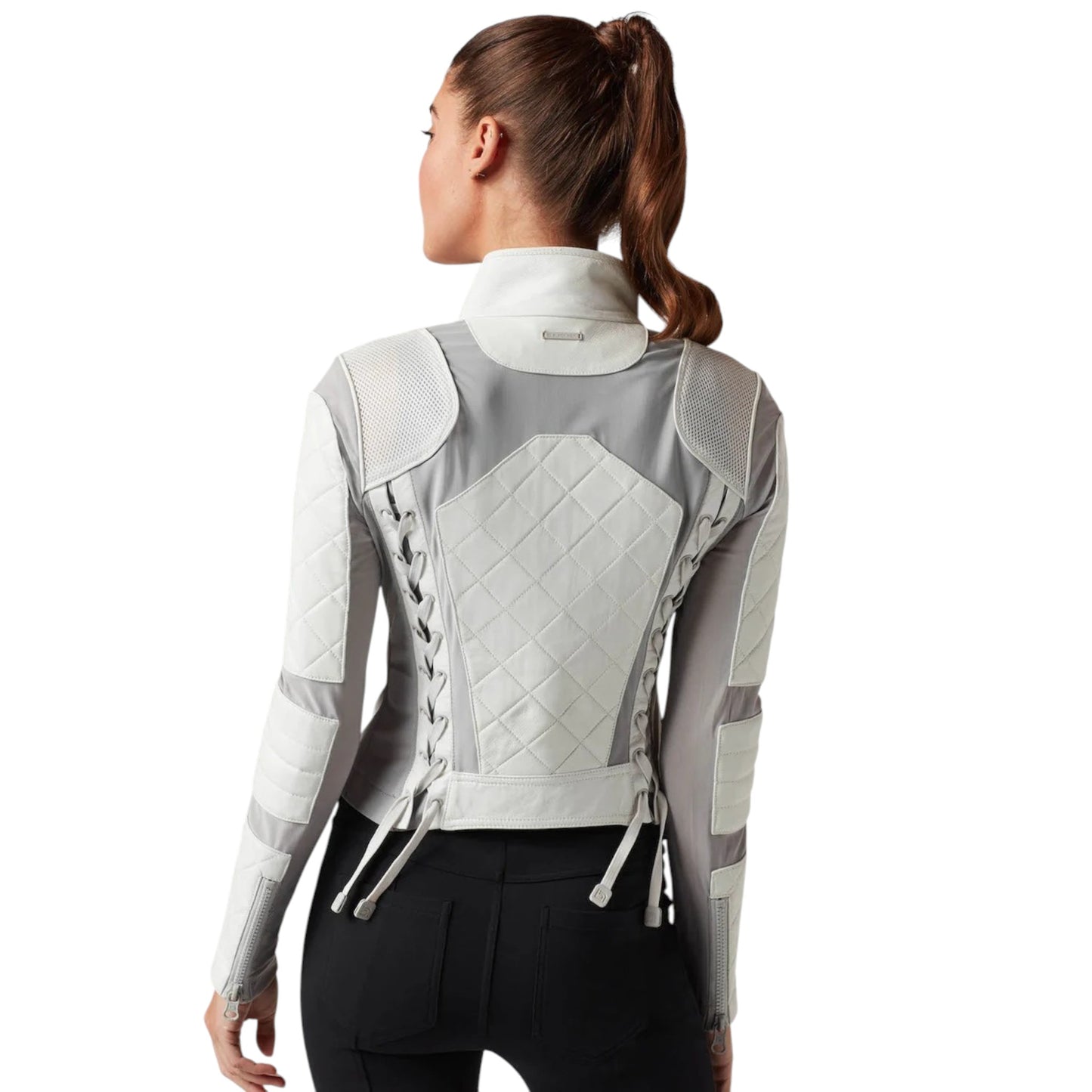 Woman wearing a gray and white quilted jacket on a white background