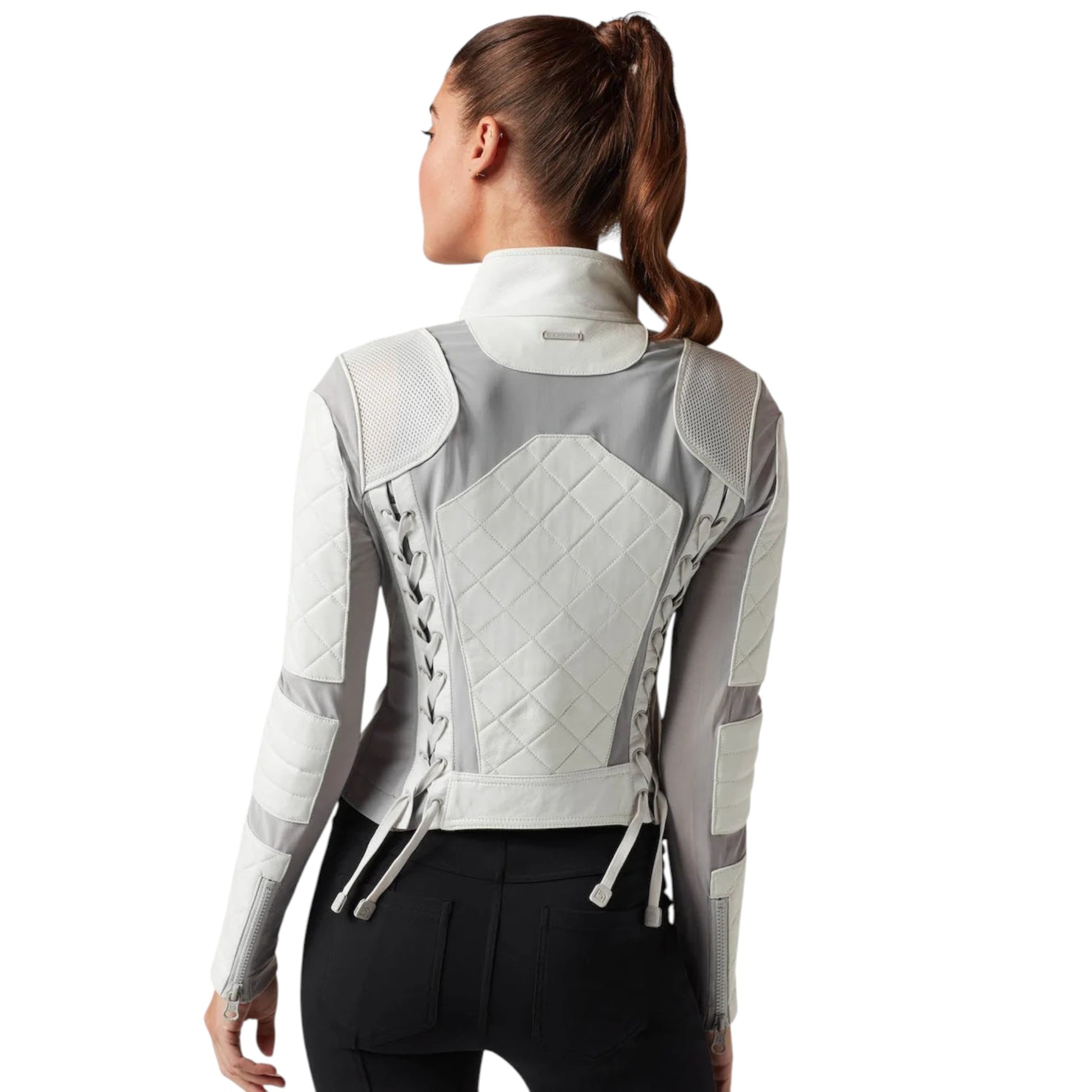 Woman wearing a gray and white quilted jacket on a white background