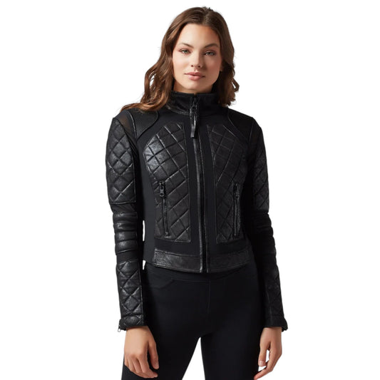 Woman wearing a black quilted jacket on a white background
