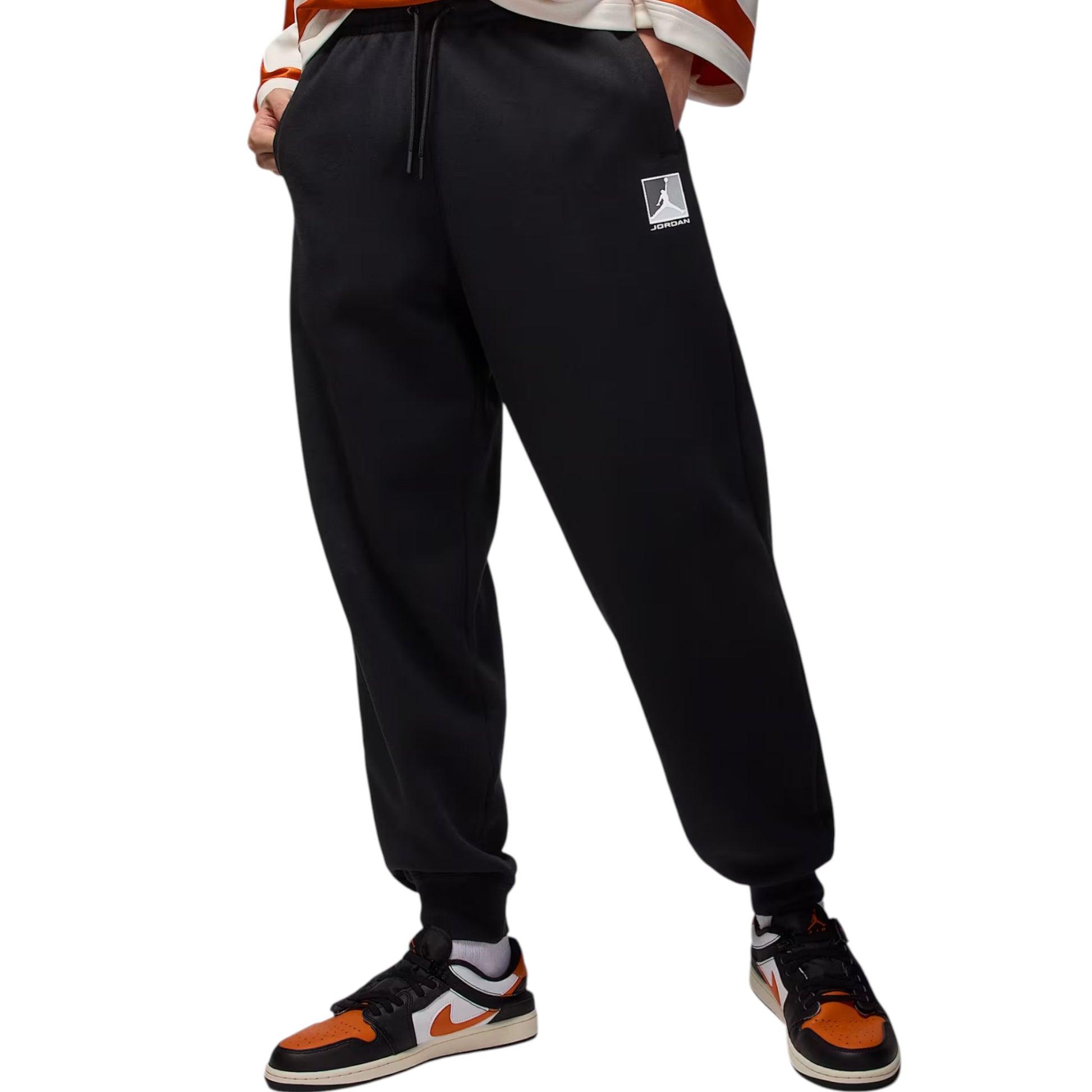 Black jogger pants with a logo on a white background