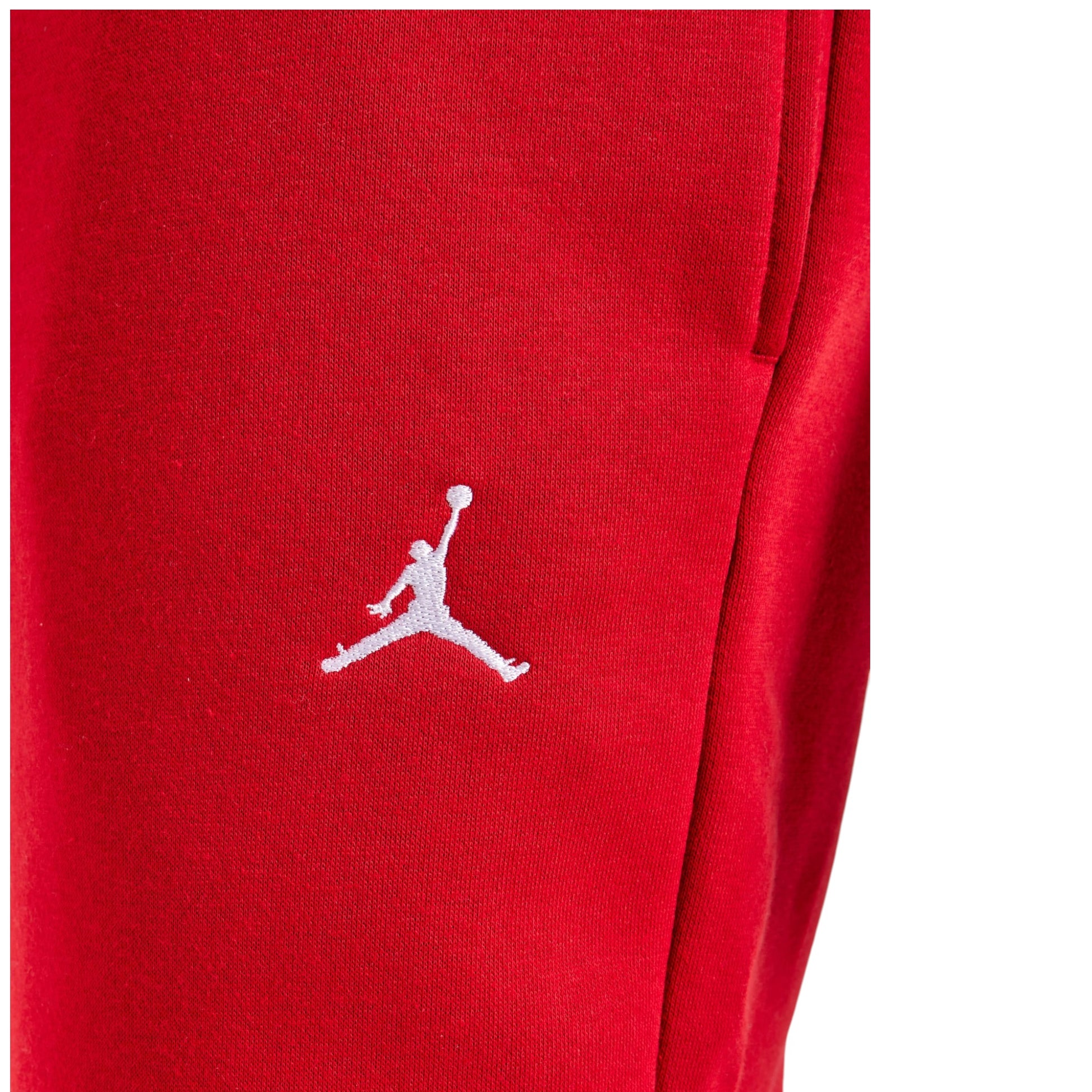 Red sweatpants with a white logo on a white background