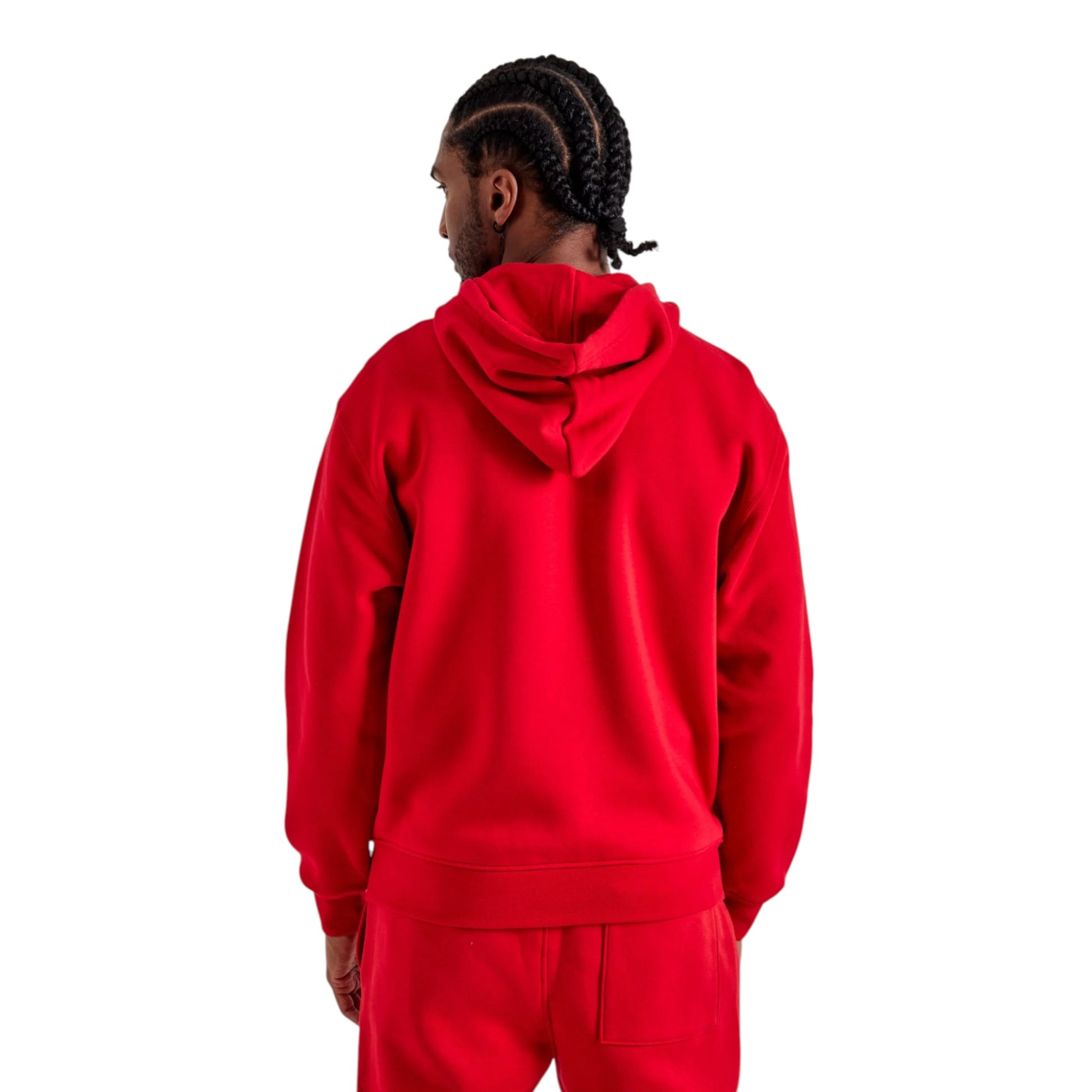 Person wearing a red hoodie and pants on a white background