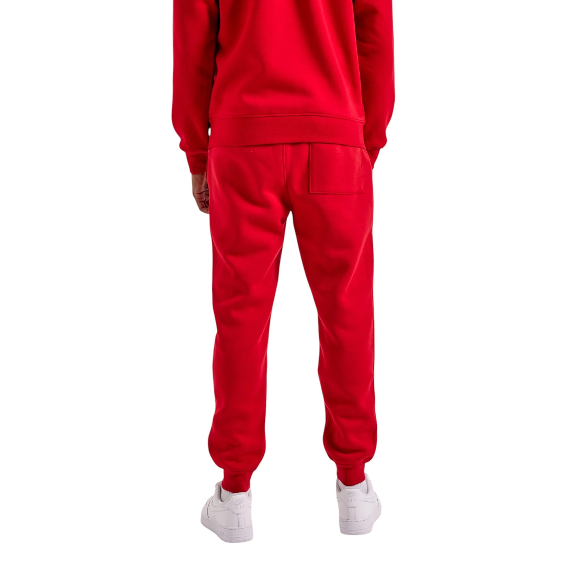 Red tracksuit with white shoes on a white background