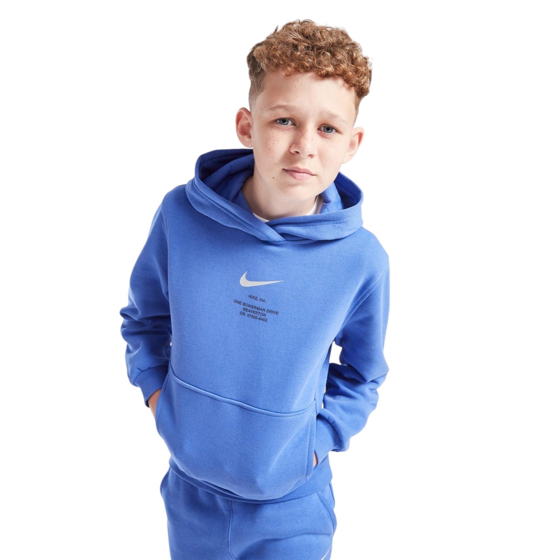 Child wearing a blue Nike hoodie on a white background