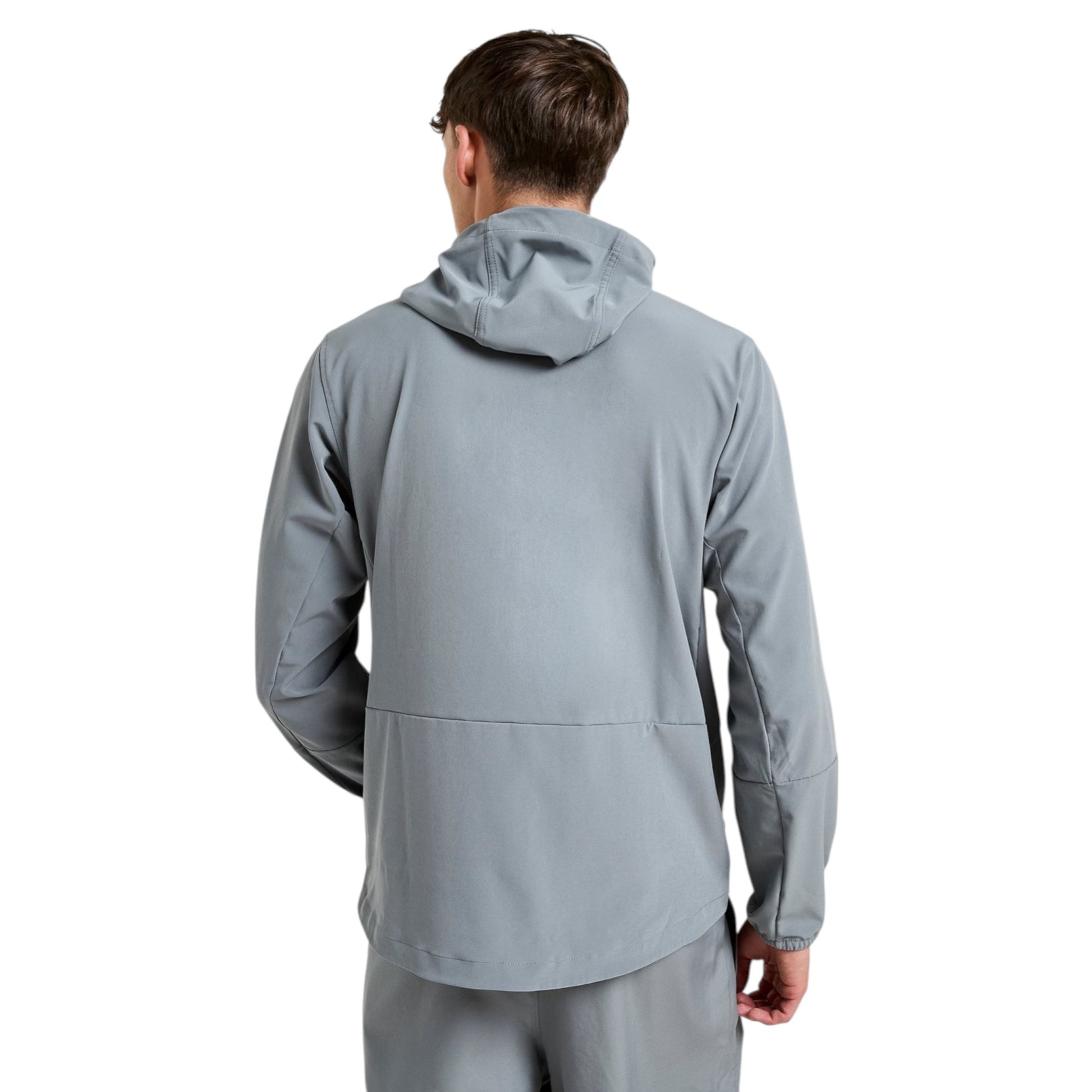 Person wearing a gray jacket on a white background