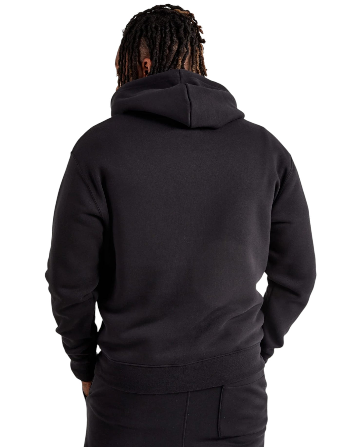Person wearing a black hoodie from behind on a white background