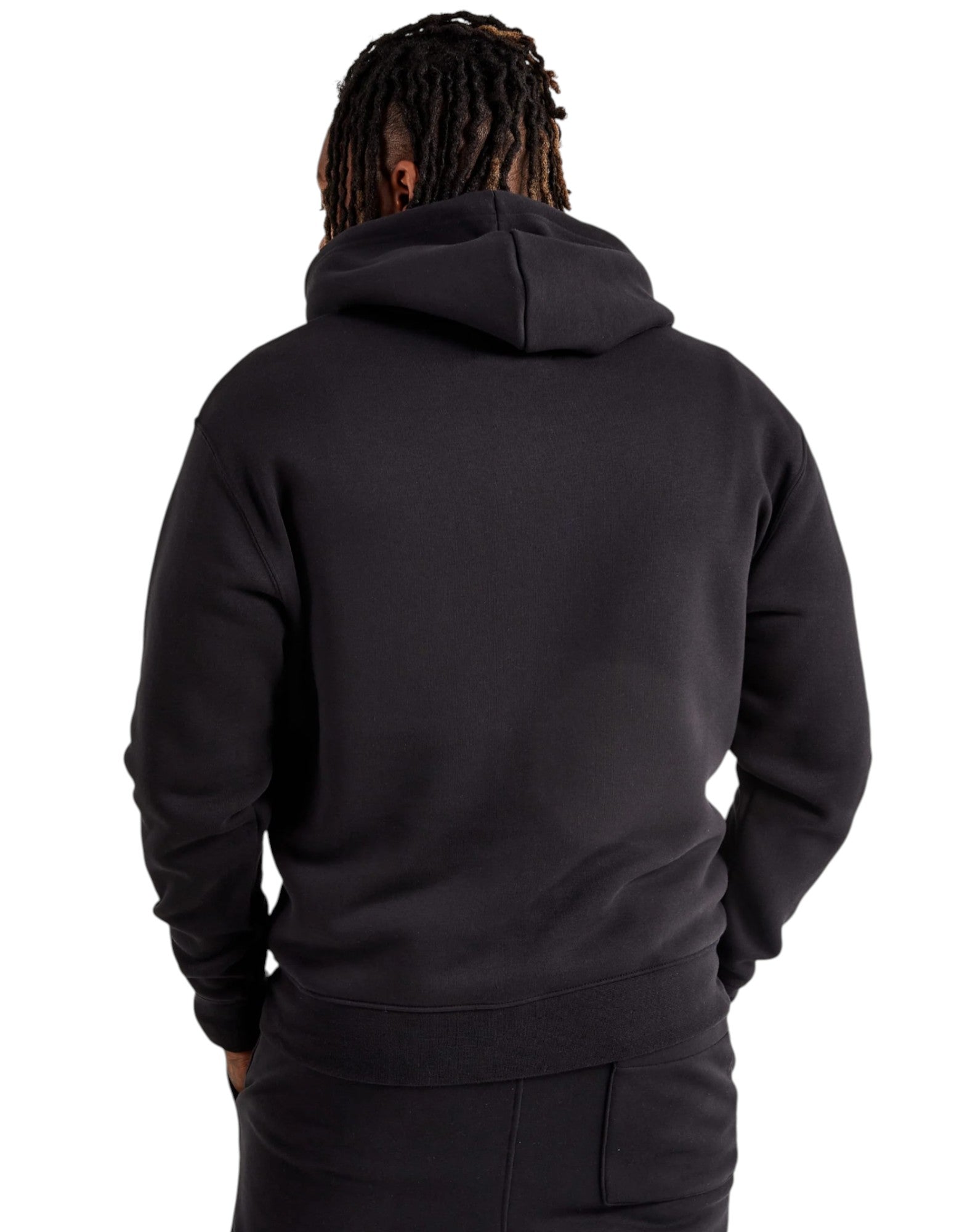 Person wearing a black hoodie from behind on a white background