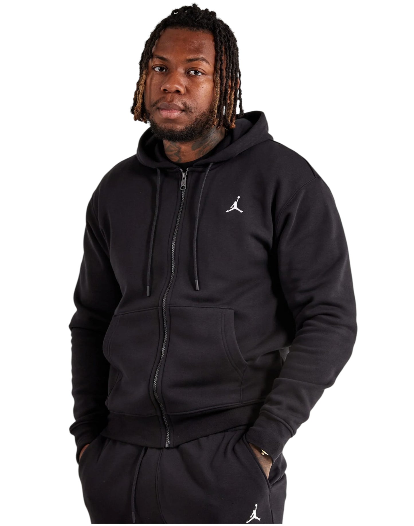 Person wearing a black hoodie with a logo on a white background