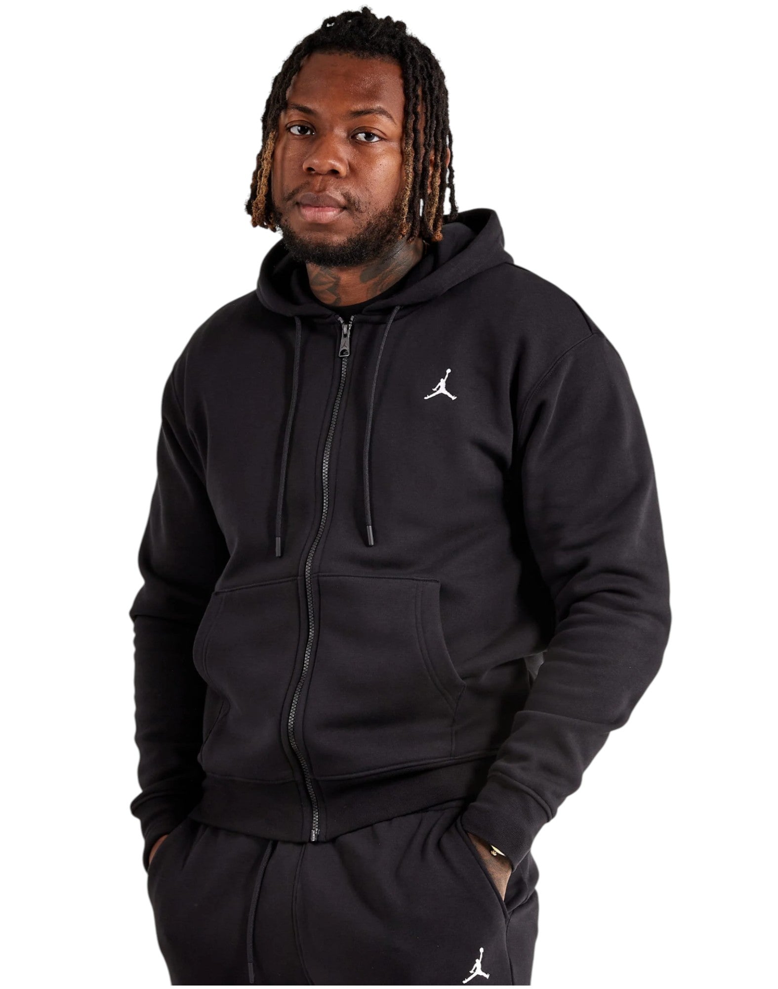 Person wearing a black hoodie with a logo on a white background