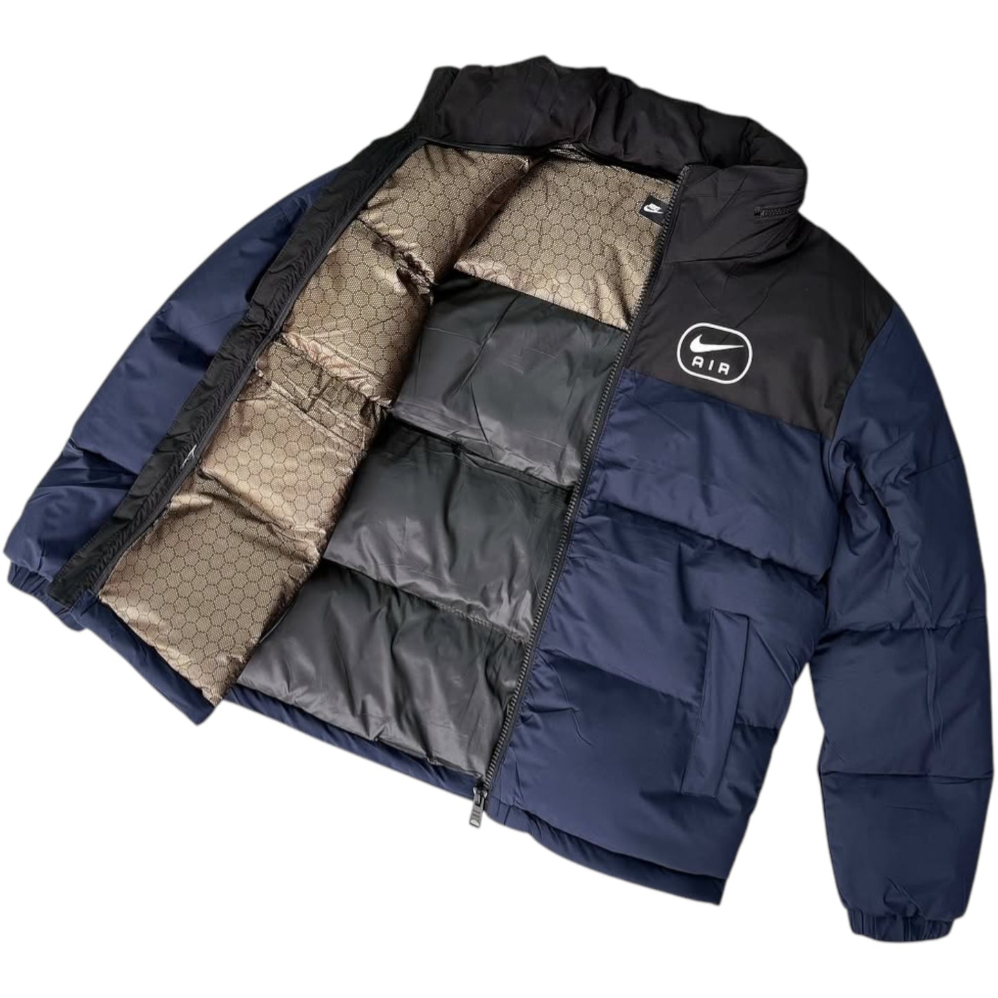 Navy blue puffer jacket with a brand logo on a white background