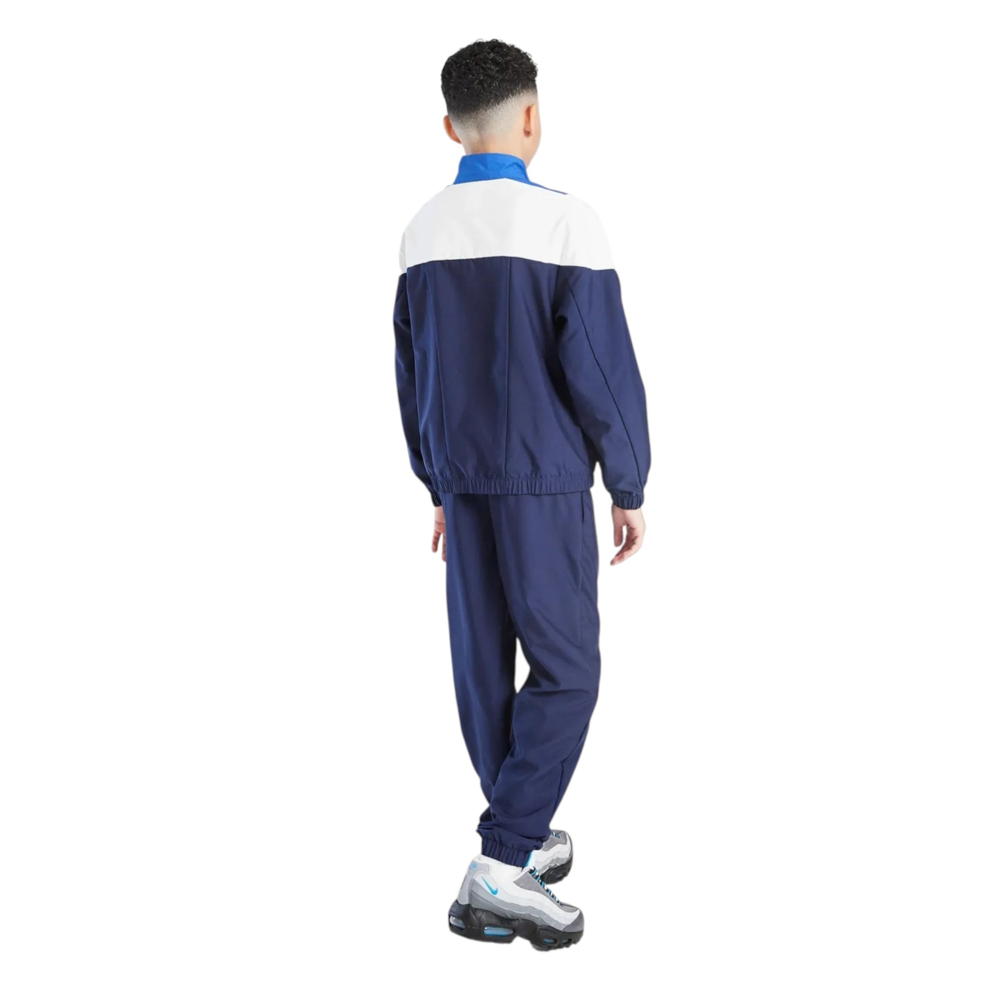 Person wearing a blue and white tracksuit on a white background