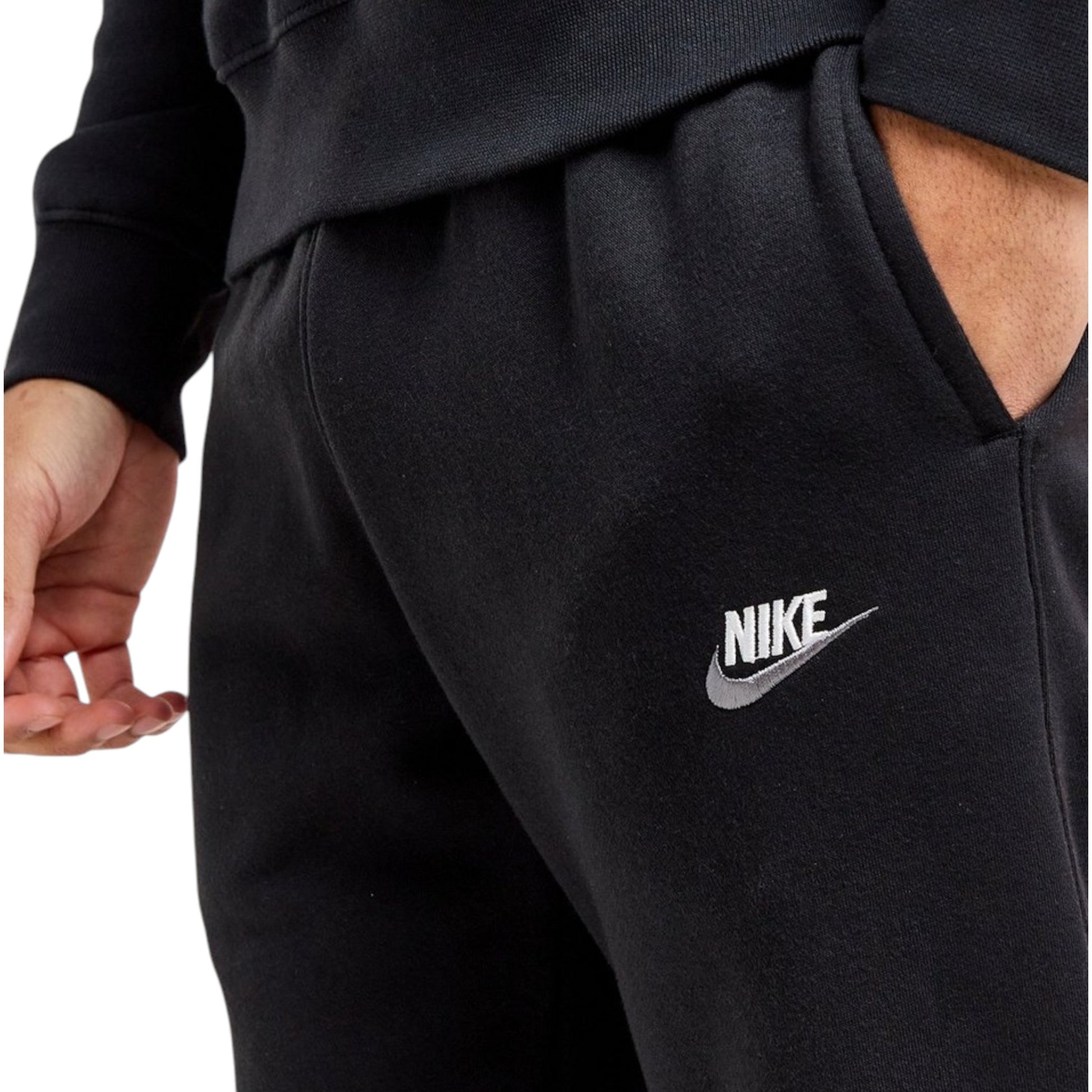 Black Nike tracksuit with logo on a white background