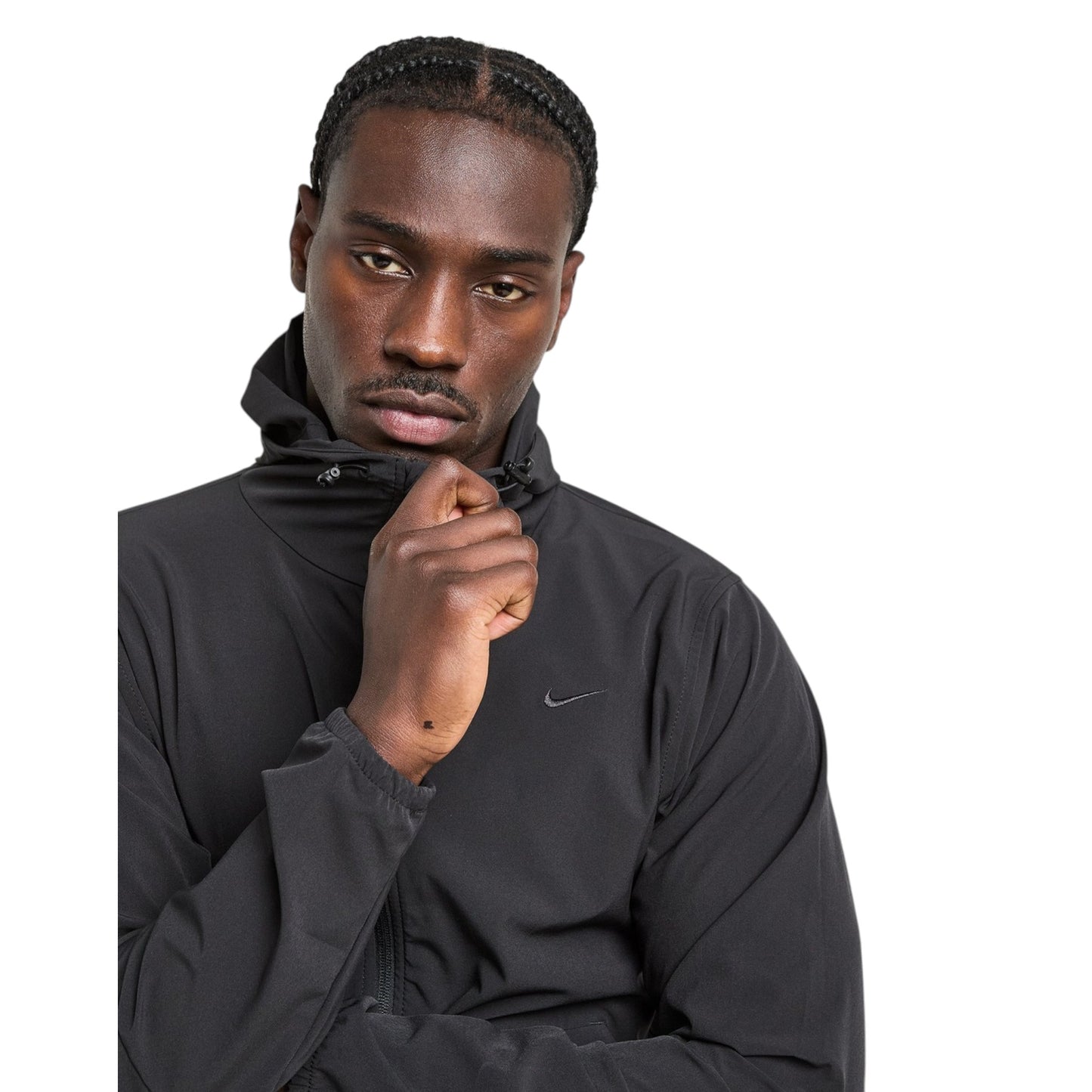 Man wearing a black jacket with a Nike logo on a white background