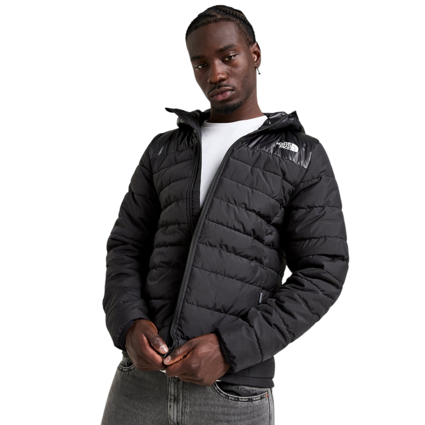 Man wearing a black puffer jacket on a white background