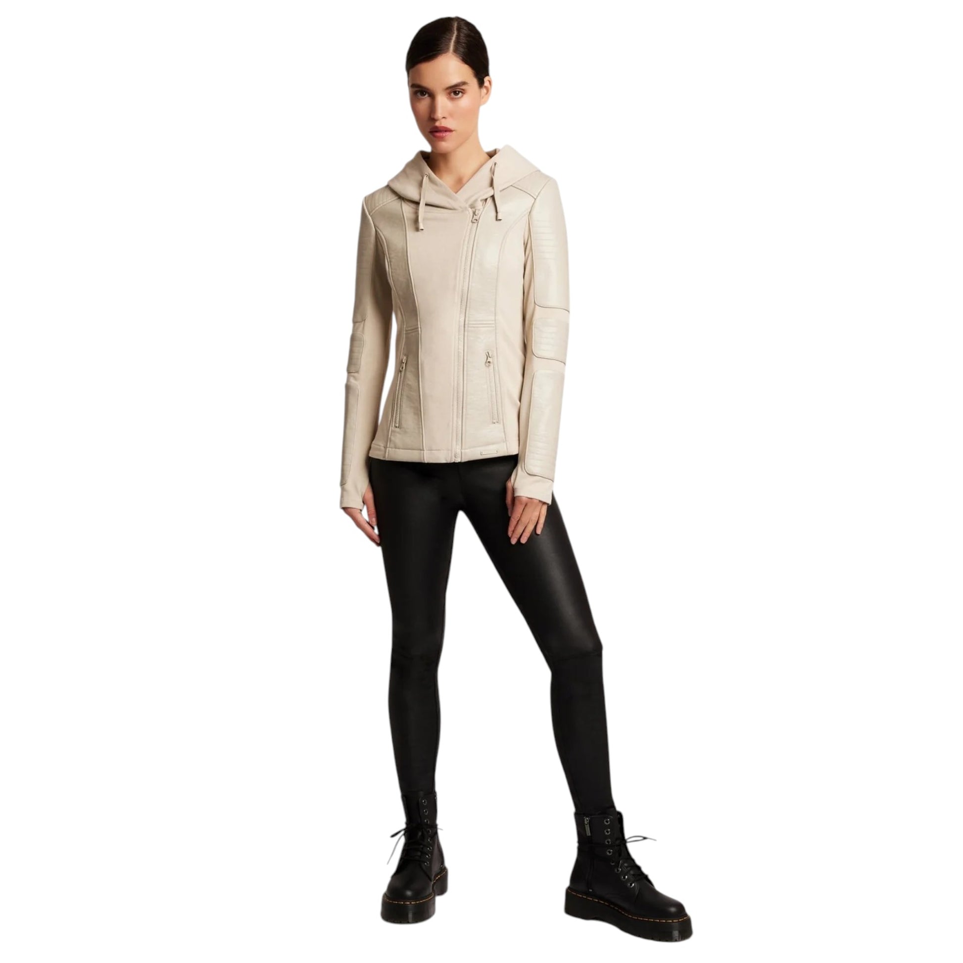 Woman wearing a beige jacket and black pants on a white background