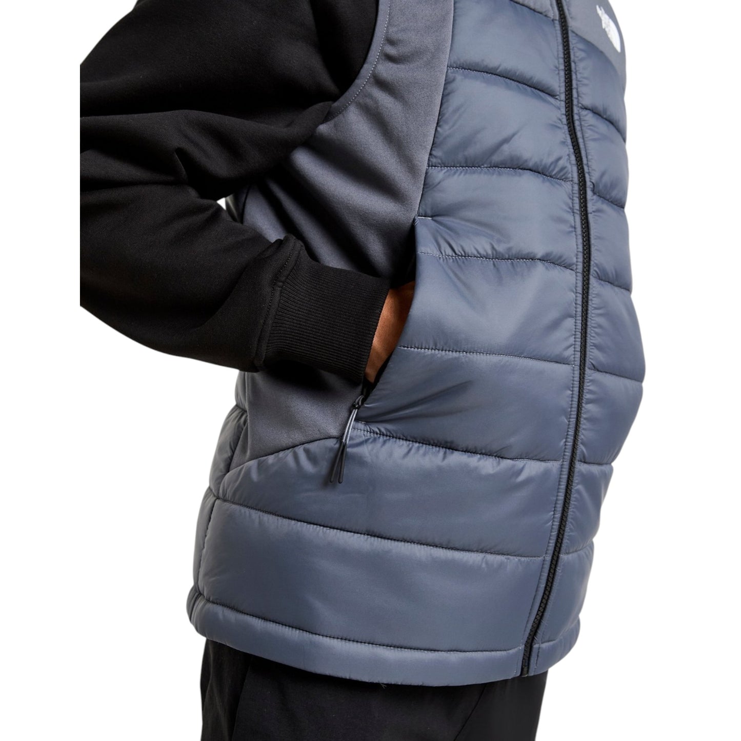Gray puffer vest worn over a black hoodie on a white background