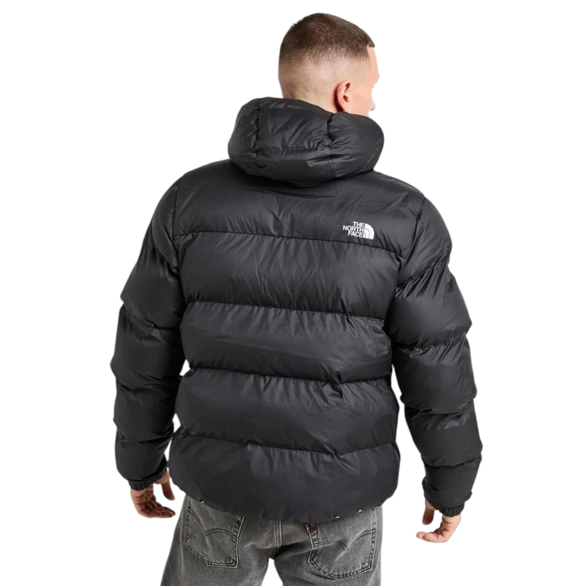 Person wearing a black puffer jacket with a brand logo on the back, standing against a white background.