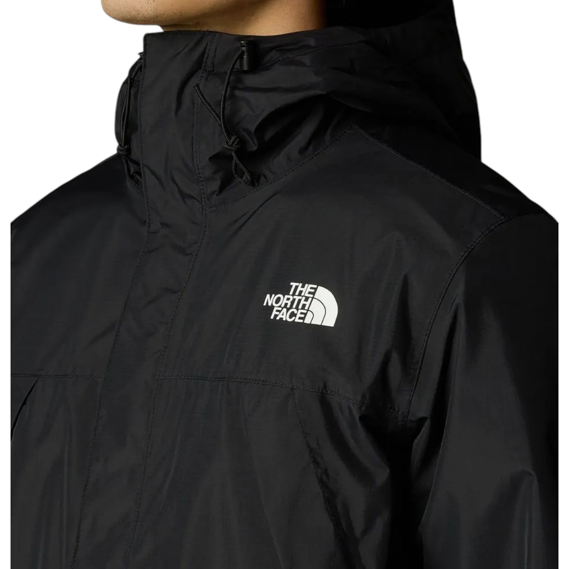 Black jacket with The North Face logo on a white background