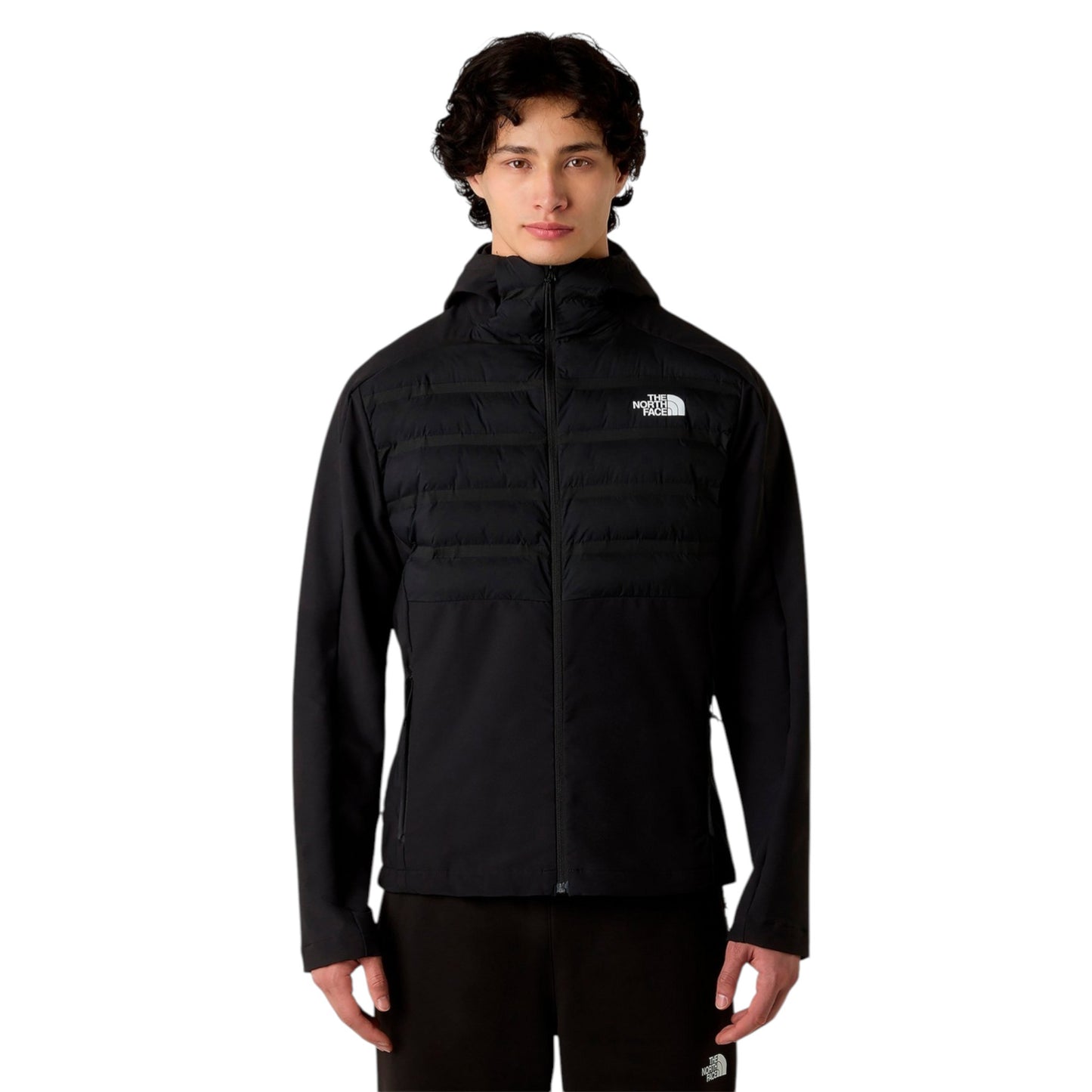 Person wearing a black jacket with a brand logo on a white background