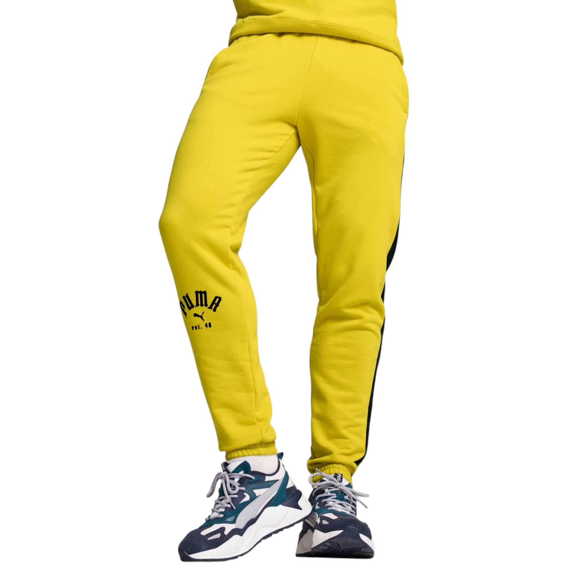 Yellow Puma sweatpants with a white background