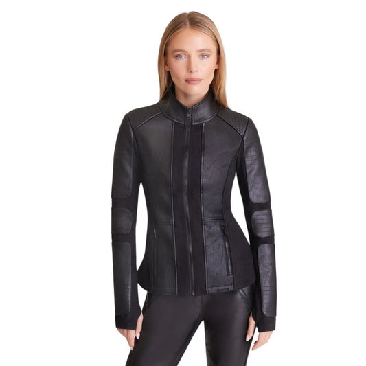 Woman wearing a black leather jacket on a white background