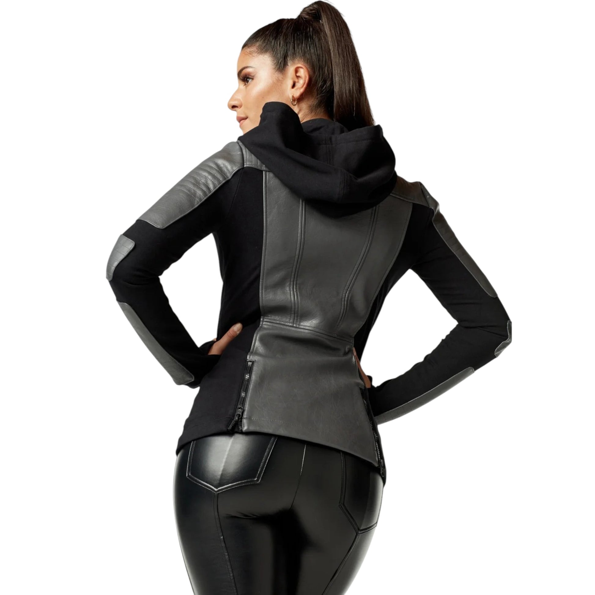Woman wearing a black leather jacket with gray accents on a white background
