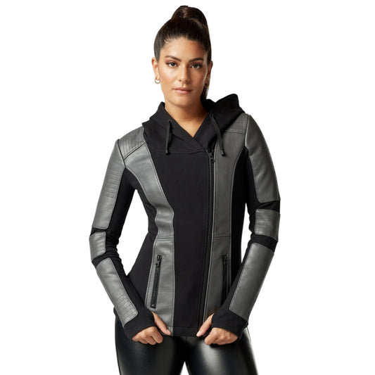 Woman wearing a black and gray jacket on a white background