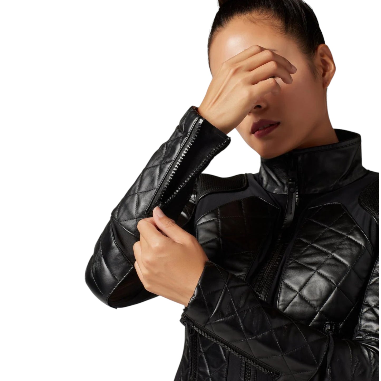 Person wearing a black quilted jacket on a white background